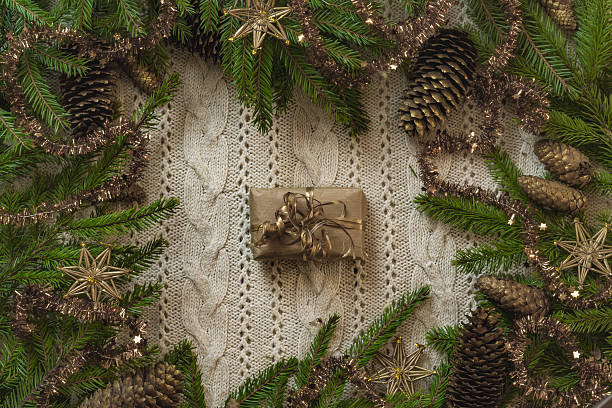 istock Christmas decoration frame with knitted wool background and fir. 629806292