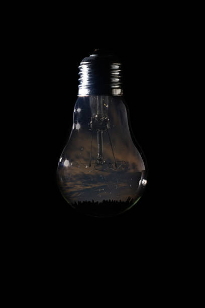 istock Beautiful night sky inside of light bulb on dark background 629806646
