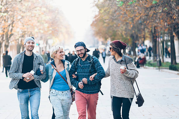 istock Friends holding hands and having fun in park 629806660