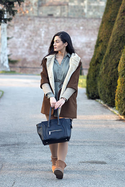 istock Pretty girl walking in a public park 629807030