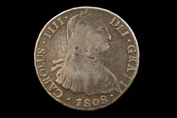 istock Antique Spanish Coin Isolated On Black 629808414