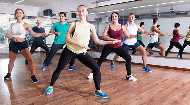istock Happy adults having group fitness class 629809484