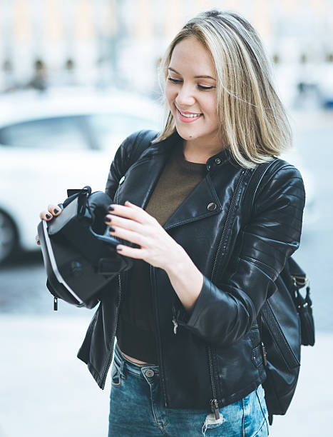 istock Women testing Virtual Reality simulator on the street 629809646