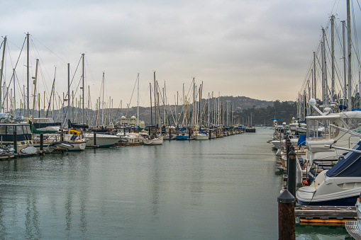 Many yachts in the marina in San Francisco Bay. Late evening, twilight, bad weather at the late October. Sausalito, California, USA