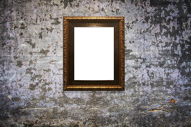 istock wooden picture frame on old wall background 629811144