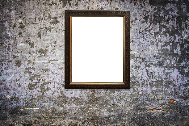 istock wooden picture frame on old wall background 629811286