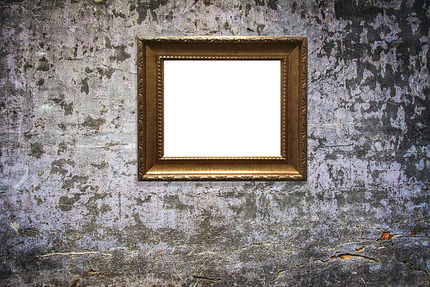 istock wooden picture frame on old wall background 629811440