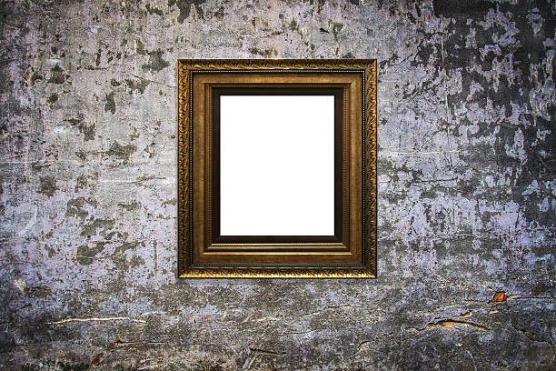 istock wooden picture frame on old wall background 629811738