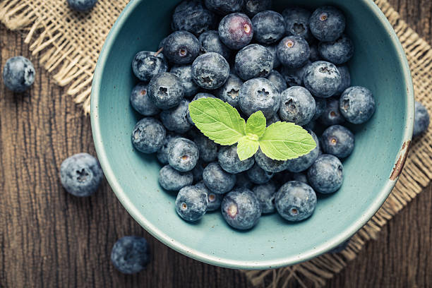 istock Blue berries in a blue bowl, 629812024