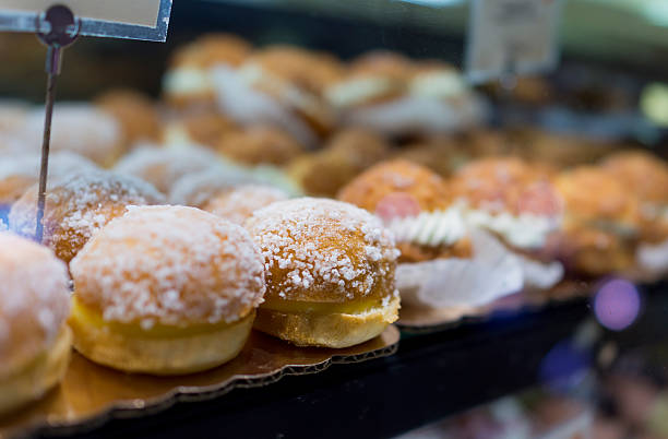 istock Display of cream puffs and pastries with powdered sugar 629814068