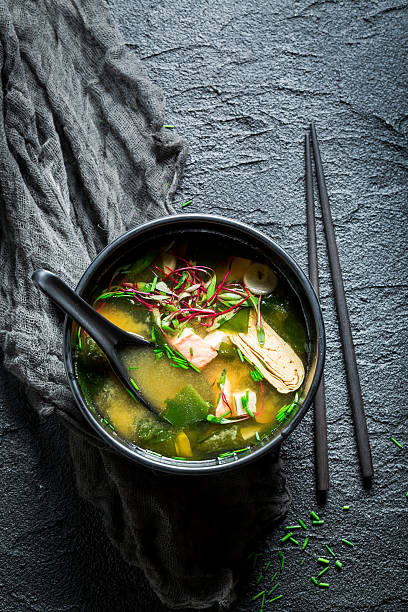istock Yummy miso soup with salmon in black bowl 629814384
