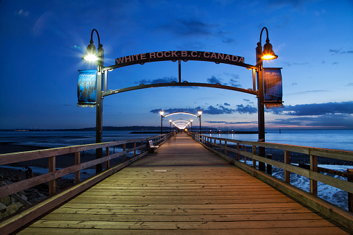 White Rock,British Columbia,Canada - January 16, 2015: White Rock pier seen in blue hour in winter.