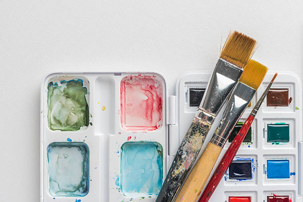 istock Box of watercolor paints and brushes 629815254