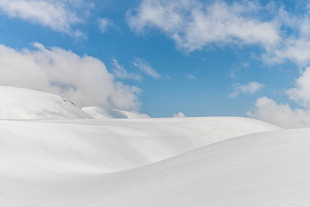 istock Snow hills against clear blue sky 629817348