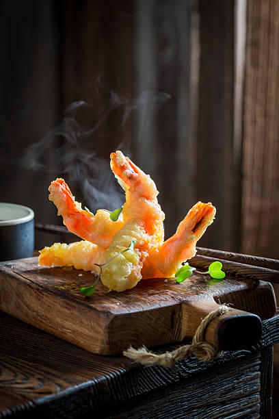 istock Enjoy your shrimp in tempura with red sauce 629820336