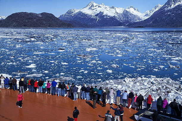 Lots of people watching glacier on a cruise ship, Alaska stock photo