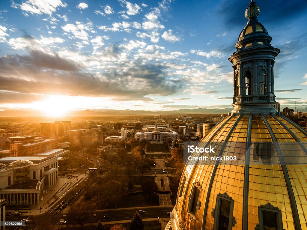 Aerial drone sunset photo.  Colorado capital building, city of Denver beautiful drone image of the golden cupola of the Colorado state capital building in the city of Denver Denver Stock Photo