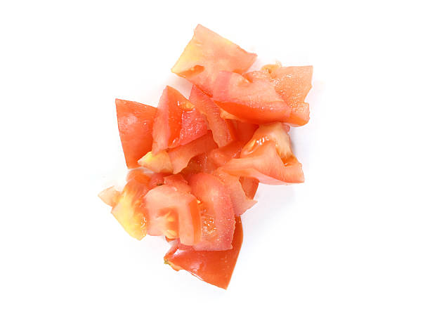 istock Red organic heirloom tomato chunks in pile 629822322