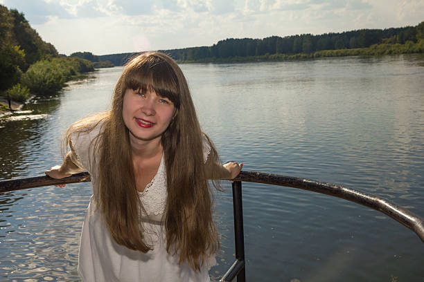 istock long hairy women posture on river background 629827502