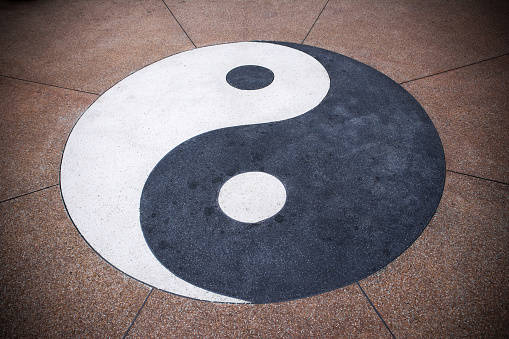 Yin yang symbol on concrete background.Yin yang texture background