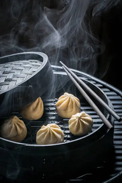 Enjoy your chinese dumplings in wooden steamer