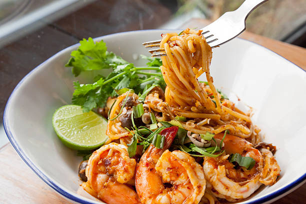 Spaghetti fried with sour prawn soup