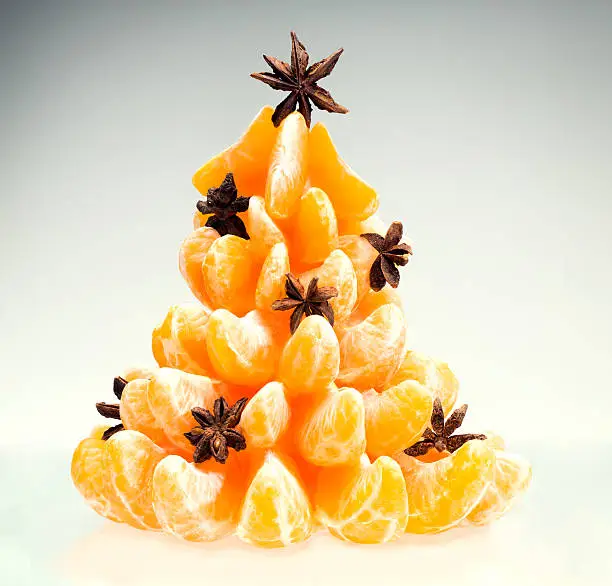 Photo of Christmas tree of tangerines with star anise.