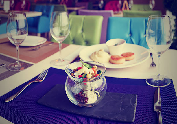 Cutlets, potato mash and vegetable salad on restaurant table, toned image