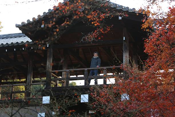 Man enjoying scenry at autumn temple