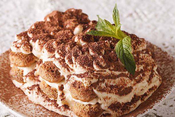 istock Italian Tiramisu cake on a plate macro. Horizontal 629839260