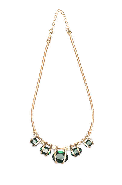 istock Pendant with green stones isolated on white 629841004