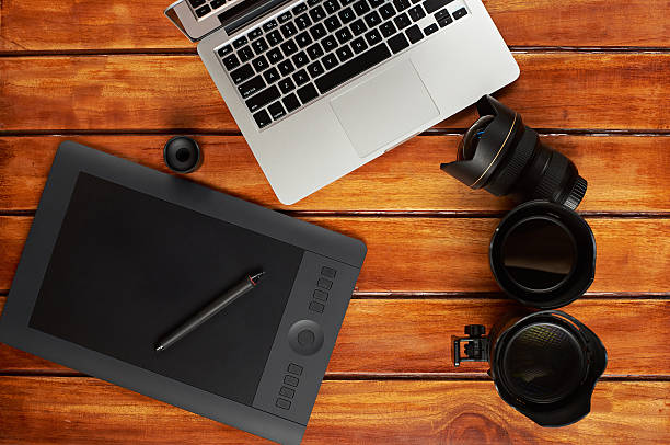 istock Photography equipment on wooden table 629841350