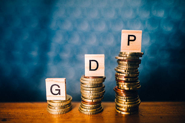GDP increase Some growing stacks of coins with the word GDP (gross domestic product) on them bringing home the bacon stock pictures, royalty-free photos & images