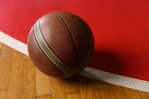 istock Basketball ball on court floor 629863300