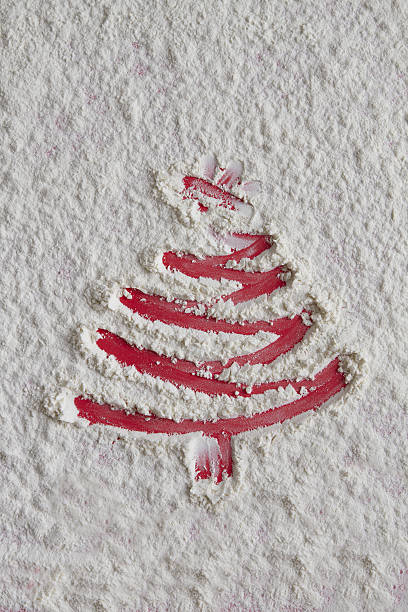 istock Christmas tree on flour background. White flour looks like snow. 629864000