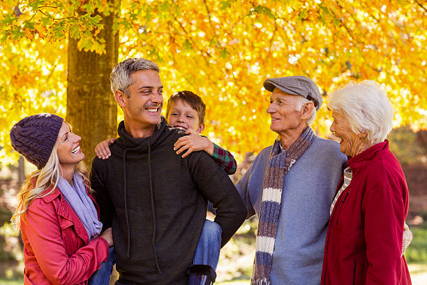 istock Happy multi-generation family standing at park 629865098