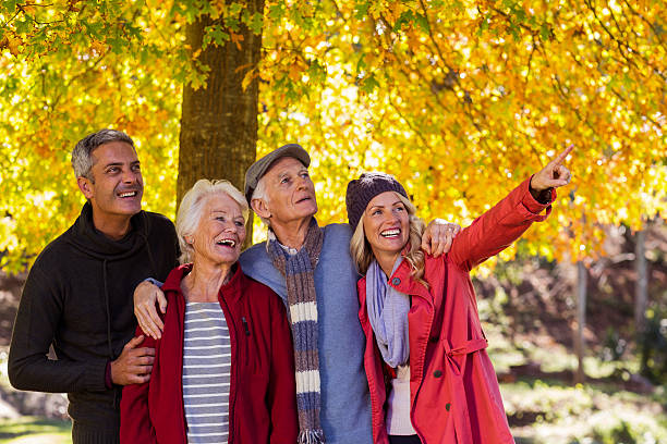 istock Happy family looking away at park 629865220