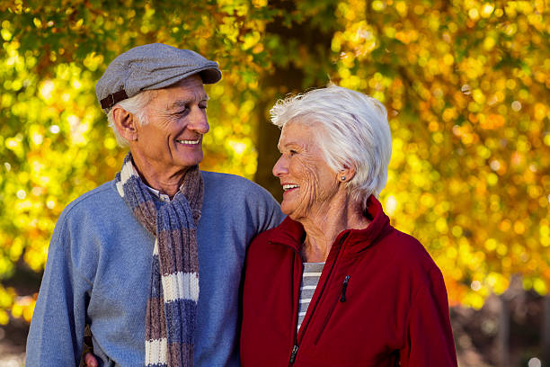 istock Happy senior couple looking at each other in park 629865336