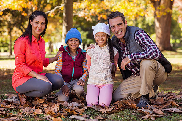 istock Happy family at park during autumn 629866236