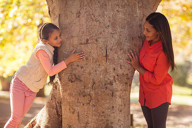 istock Playful mother with daughter at park 629866560