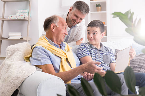 istock Grandfather and grandson using laptop 629866818