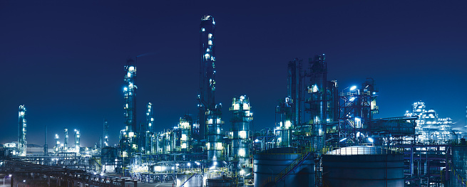 Oil Refinery, chemical & petrochemical plant at night.