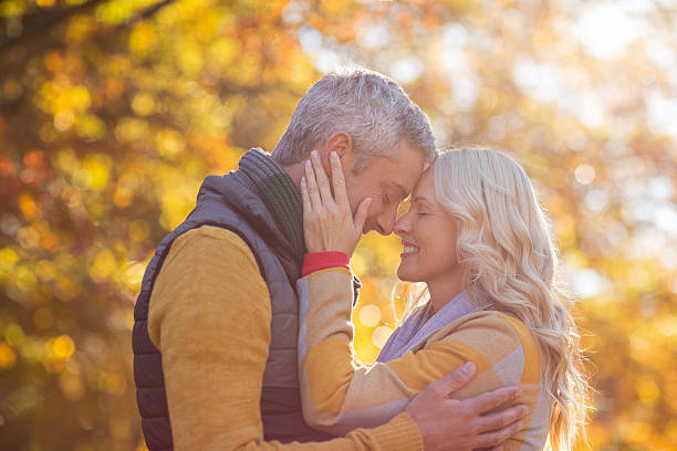istock Side view of romantic couple at park 629868242