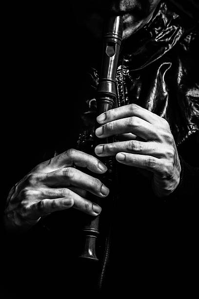 istock male musician hands playing on recorder 629940988