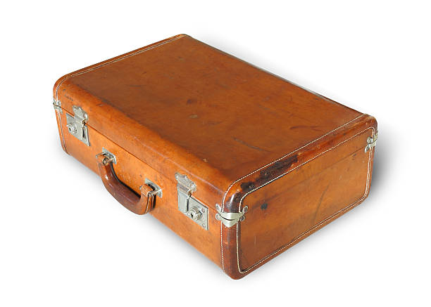 old weathered leather suitcase old weathered leather suitcase isolated on white with clipping path leather medical bag stock pictures, royalty-free photos & images