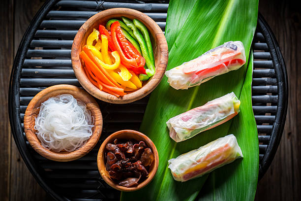 Prepartion for fresh spring rolls on black table