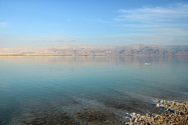 istock Dead Sea and the coast, lit by the sun 629944330