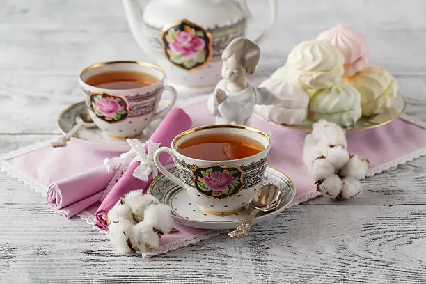 Photo of Tea with tea pot on white background