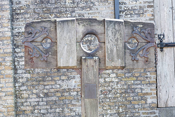 istock Old wooden pillory close up 629951290