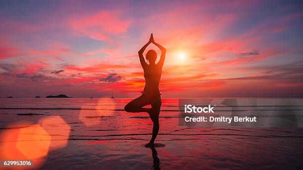 Meditation Girl On The Sea During Sunset Stock Photo - Download Image Now - Yoga, Red, Outdoors